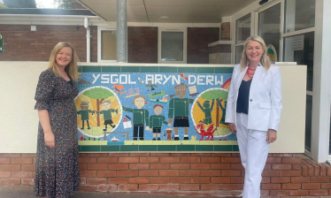 Laura Anne Jones and Jayne Bryant outside of Ysgol Bryn Derw