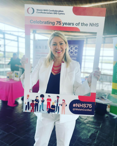 Laura with 'Happy 75th Birthday NHS' Sign