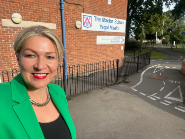 Laura in front of Maelor School sign 